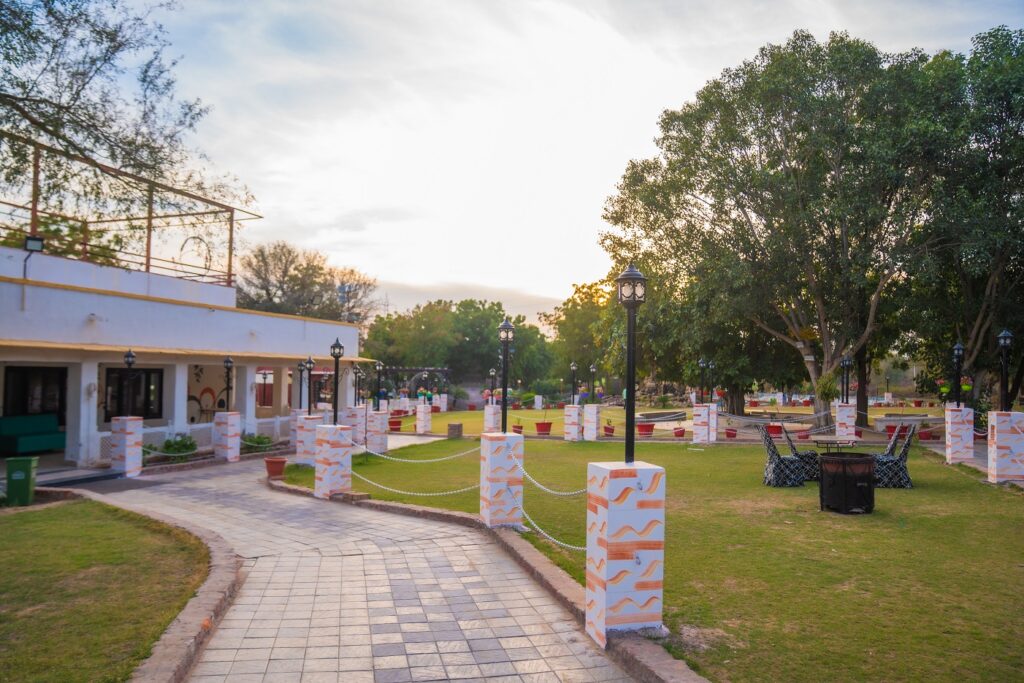 Beautiful garden and outdoor seating area at Thar Exotica – Best Hotel in Bikaner